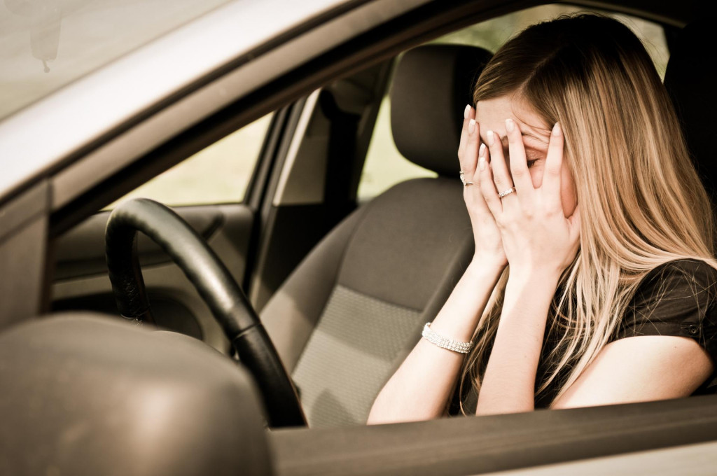 &lt;p&gt;Young woman with hands on eyes sitting depressed in car&lt;/p&gt;