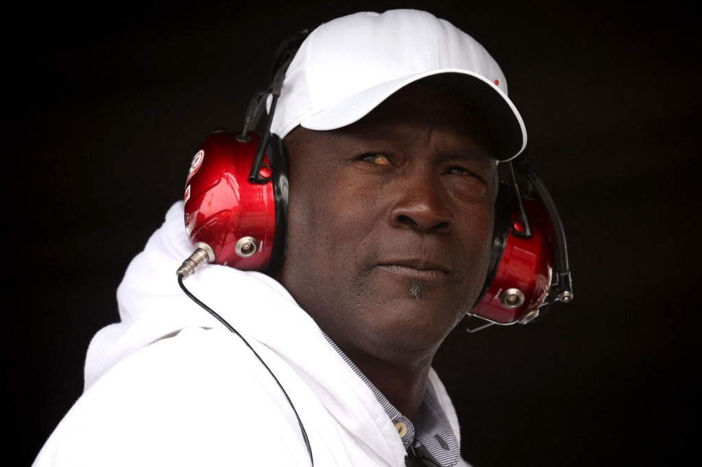 &lt;p&gt;(FILES) Michael Jordan, NBA Hall of Famer and co-owner of 23XI Racing, looks on from the 23XI Racing pit box during the NASCAR Cup Series GEICO 500 at Talladega Superspeedway on April 23, 2023 in Talladega, Alabama. An auto racing team co-owned by NBA legend Michael Jordan filed an anti-trust lawsuit on October 2, 2024, against the National Association for Stock Car Auto Racing (NASCAR) and its chief executive Jim France. (Photo by James Gilbert/GETTY IMAGES NORTH AMERICA/AFP)&lt;/p&gt;