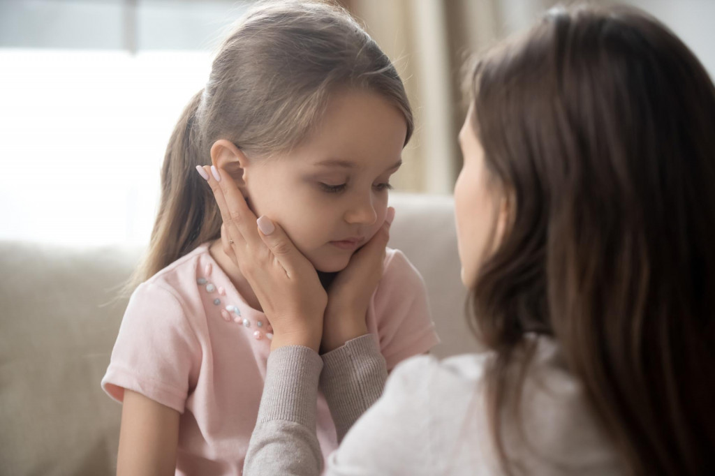 &lt;p&gt;Loving young mother touching upset little daughter face, expressing support, young mum comforting offended adorable preschool girl, showing love and care, child psychologist concept, close up&lt;/p&gt;