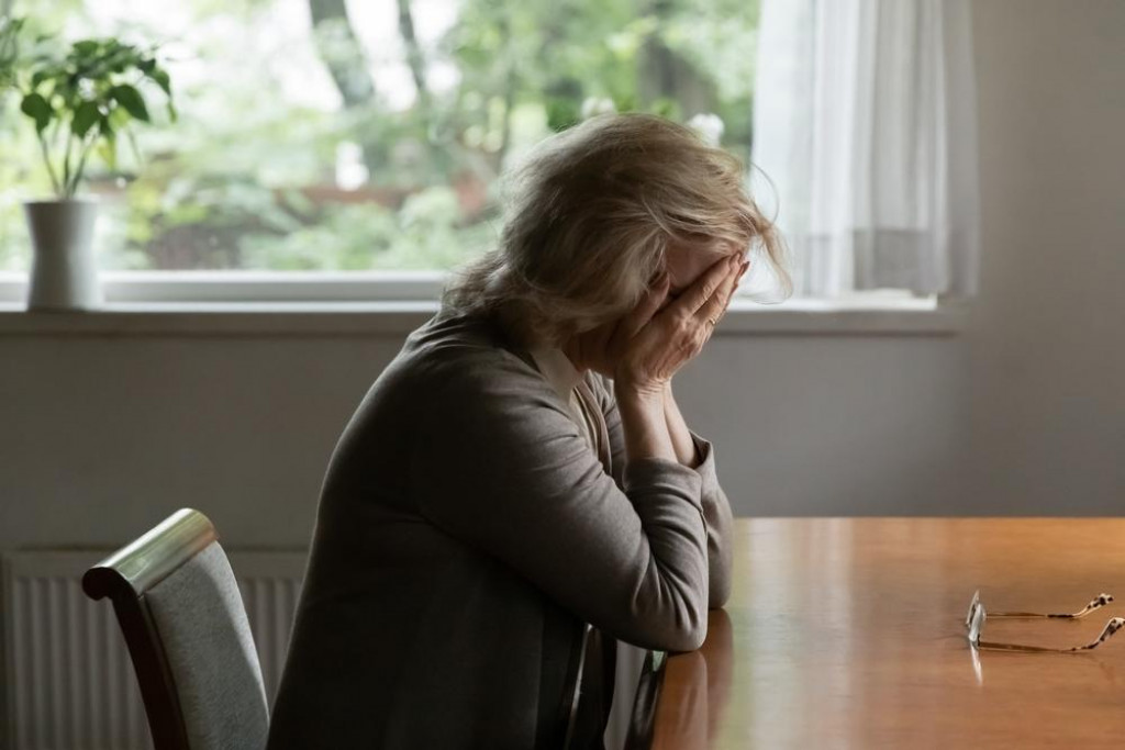 &lt;p&gt;Unhappy old Caucasian woman sit at table at home cry feeling depressed sad suffer from life or health problems. Upset lonely mature female distressed with loneliness solitude, mourn yearn at home.&lt;/p&gt;