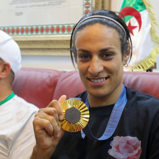 &lt;p&gt;Algerian gold medallist Imane Khelif poses for a picture as she sits with relatives in her hometown city of Tiaret on August 16, 2024. (Photo by AFP)&lt;/p&gt;