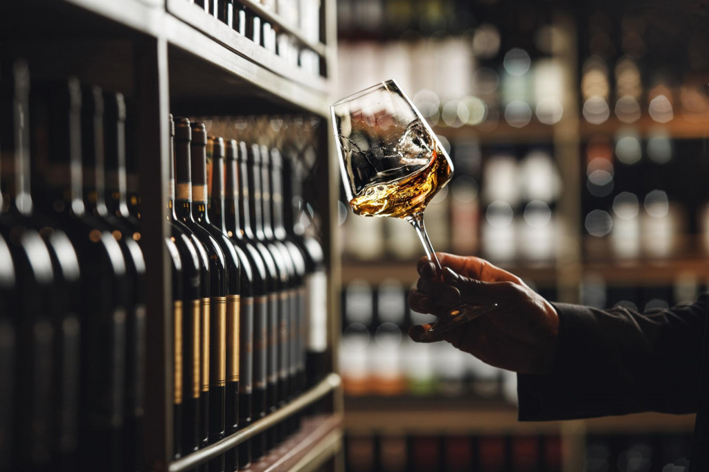 &lt;p&gt;Close-Up of Sommelier Tasting White Wine in Dimly Lit Cellar&lt;/p&gt;