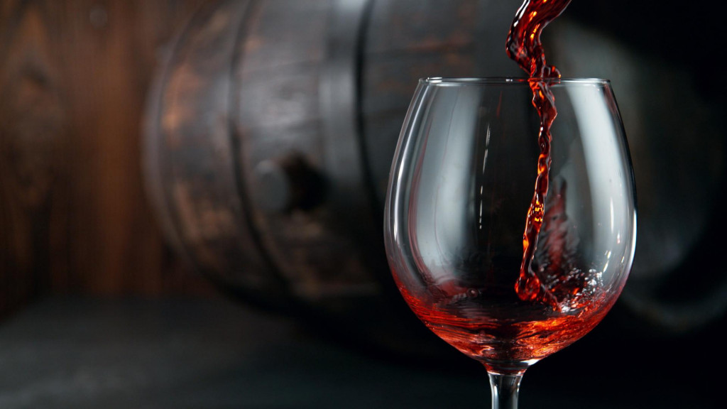 &lt;p&gt;Pouring red wine into wine glass on dark background, still life background&lt;/p&gt;