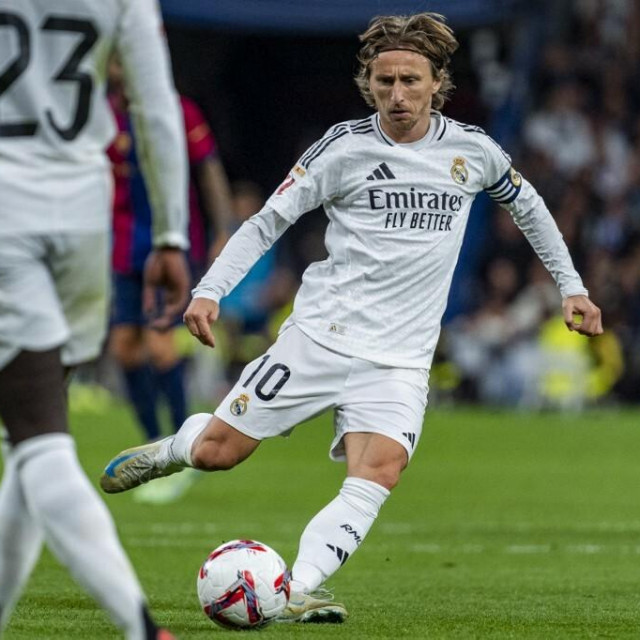 &lt;p&gt;Luka Modric of Real Madrid CF is in action with the ball during the La Liga EA Sports 2024/25 football match between Real Madrid CF and FC Barcelona at Estadio Santiago Bernabeu in Madrid, Spain, on October 26, 2024. (Photo by Alberto Gardin/NurPhoto) (Photo by Alberto Gardin/NurPhoto/NurPhoto via AFP)&lt;/p&gt;