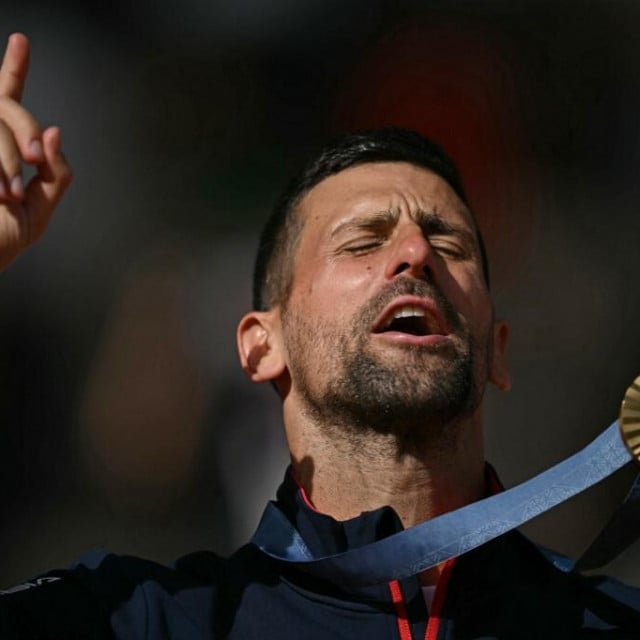 &lt;p&gt;Gold medallist, Serbia‘s Novak Djokovic poses with his medal on the podium at the presentation ceremony for the men‘s singles tennis event on Court Philippe-Chatrier at the Roland-Garros Stadium during the Paris 2024 Olympic Games, in Paris on August 4, 2024. (Photo by CARL DE SOUZA/AFP)&lt;/p&gt;