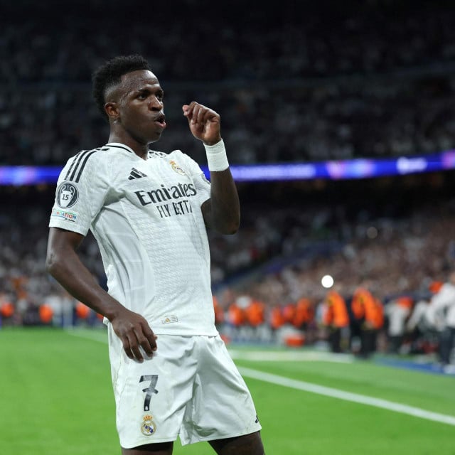 &lt;p&gt;Real Madrid‘s Brazilian forward #07 Vinicius Junior celebrates scoring a hat-trick and his team‘s fifth goal during the UEFA Champions League, league phase day 3 football match between Real Madrid CF and Borussia Dortmund at the Santiago Bernabeu stadium in Madrid on October 22, 2024. (Photo by Thomas COEX/AFP)&lt;/p&gt;