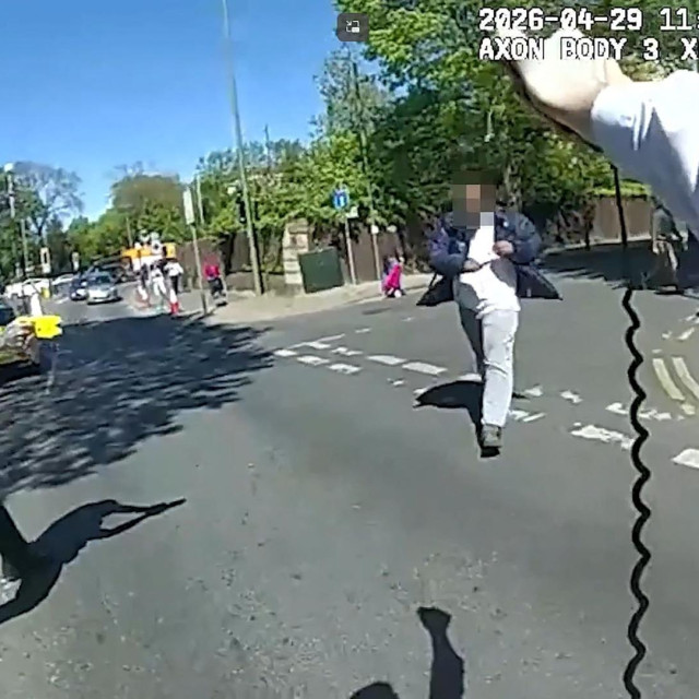 <p>TOPSHOT - This screen grab taken from video released late on April 29, 2026 of body-cam footage showing police pointing their tasers at a man (C) holding a knife in the street before arresting him in the Golders Green neighbourhood of north London on April 29, 2026, after he allegedly stabbed two people nearby. The UK government on April 30 announced an extra 25 million pounds (33 million USD) for security outside synagogues and schools, a day after two Jews were stabbed in the latest attack on the community. A 45-year-old man, a British national who was born in Somalia and came to the UK as a child, remains in custody following the stabbings. (Photo by Handout/Metropolitan Police/AFP)/- NO Marketing campaign/-----EDITORS NOTE --- RESTRICTED TO EDITORIAL USE - MANDATORY CREDIT &rdquo;AFP PHOTO/Metropolitcan Police &rdquo; - NO MARKETING - NO ADVERTISING CAMPAIGNS - DISTRIBUTED AS A SERVICE TO CLIENTS</p>