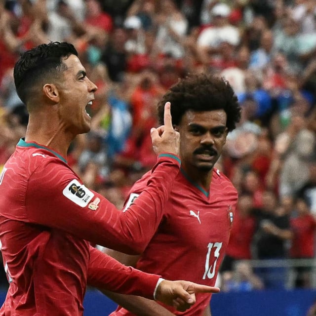 <p>Portugal&lsquo;s forward #07 Cristiano Ronaldo (L) celebrates after scoring the opening goal during the 2026 World Cup Group K football match between Portugal and Uzbekistan at the Houston Stadium in Houston on June 23, 2026. (Photo by RONALDO SCHEMIDT/AFP)</p>