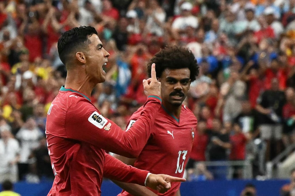 <p>Portugal&lsquo;s forward #07 Cristiano Ronaldo (L) celebrates after scoring the opening goal during the 2026 World Cup Group K football match between Portugal and Uzbekistan at the Houston Stadium in Houston on June 23, 2026. (Photo by RONALDO SCHEMIDT/AFP)</p>