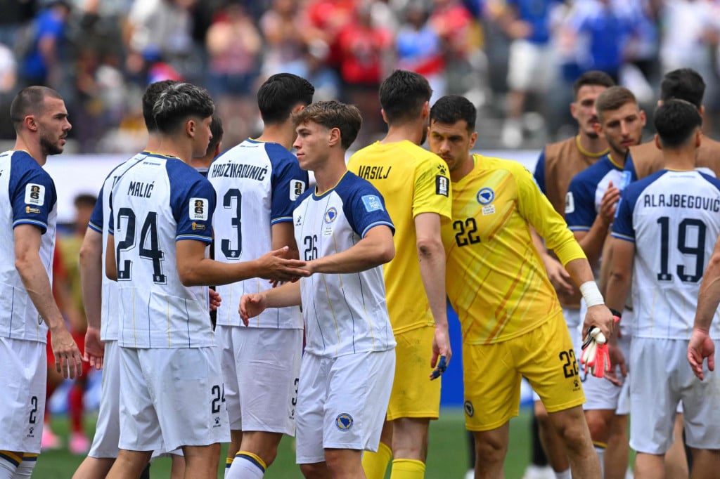 <p>Bosnia-Herzegovina&lsquo;s defender #24 Nidal Celik and midfielder #26 Ermin Mahmic react after losing the 2026 World Cup Group B football match between Switzerland and Bosnia and Herzegovina at Los Angeles Stadium in Inglewood on June 18, 2026. (Photo by Patrick T. Fallon/AFP)</p>