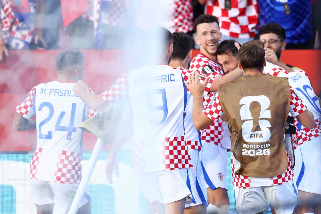 <p>Croatia&lsquo;s forward #11 Ante Budimir (2nd-L) celebrates with teammates scoring his team&lsquo;s first goal during the 2026 World Cup Group L football match between Panama and Croatia at the Toronto Stadium in Toronto on June 23, 2026. (Photo by Cole Burston/AFP)</p>