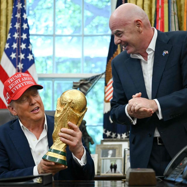 <p>(FILES) US President Donald Trump joined by FIFA president Gianni Infantino (R) holds the World Cup Trophy as he makes an announcement in the Oval Office of the White House in Washington, DC, on August 22, 2025. US President Donald Trump will attend the World Cup final in New Jersey on July 19 and present the trophy to the winners, FIFA President Gianni Infantino announced on June 23, 2026. &rdquo;We will be together with the president enjoying the final and handing the trophy to the winner, of course, together,&rdquo; Infantino told Fox and Friends. (Photo by ANDREW CABALLERO-REYNOLDS/AFP)</p>