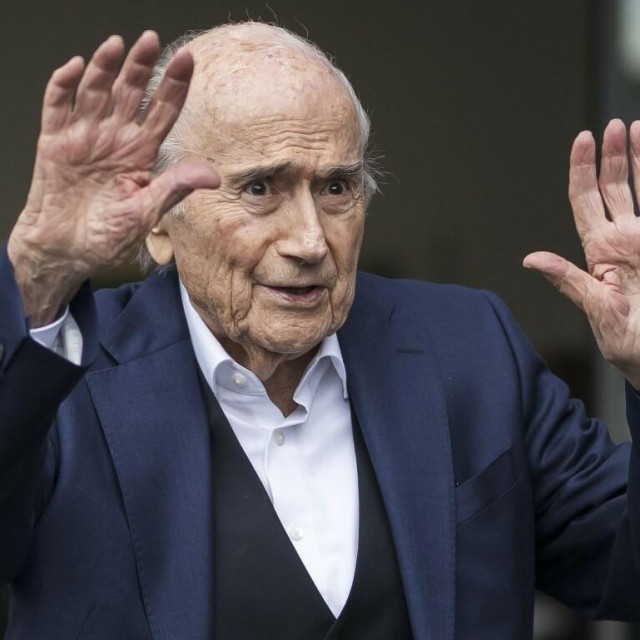 <p>Former FIFA president Sepp Blatter reacts as he leaves the courthouse after the verdict of an appeal by Swiss Attorney General&lsquo;s office against former UEFA and FIFA presidents over a suspected fraudulent payment, in Muttenz near Basel, on March 25, 2025. Former FIFA president Sepp Blatter and ex-UEFA chief Michel Platini were acquitted again on March 25, 2025 on appeal by a Swiss court in a long-running corruption case. (Photo by Fabrice COFFRINI/AFP)</p>
