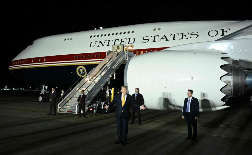 <p>(FILES) US President Donald Trump gestures in front of Air Force One after disembarking from the older VC-25A Air Force One at Royal Air Force (RAF) Mildenhall in Mildenhall, eastern England on July 8, 2026, before continuing his journey to the United States while returning from a NATO summit in Turkey. US President Donald Trump secretly flew out of Turkey last month on a smaller plane than previously known due to an assassination threat from Iran, the Washington Post reported late August 10, 2026. According to an anonymous US official who spoke to the Post, Trump boarded an Air Force One jet in Ankara on July 8, but then moved into a catering container attached to the plane. The container then ferried him to a smaller C-32A aircraft that flew him to Britain, while media and some officials were led to believe Trump was still on the bigger jet. (Photo by SAUL LOEB/AFP)</p>
