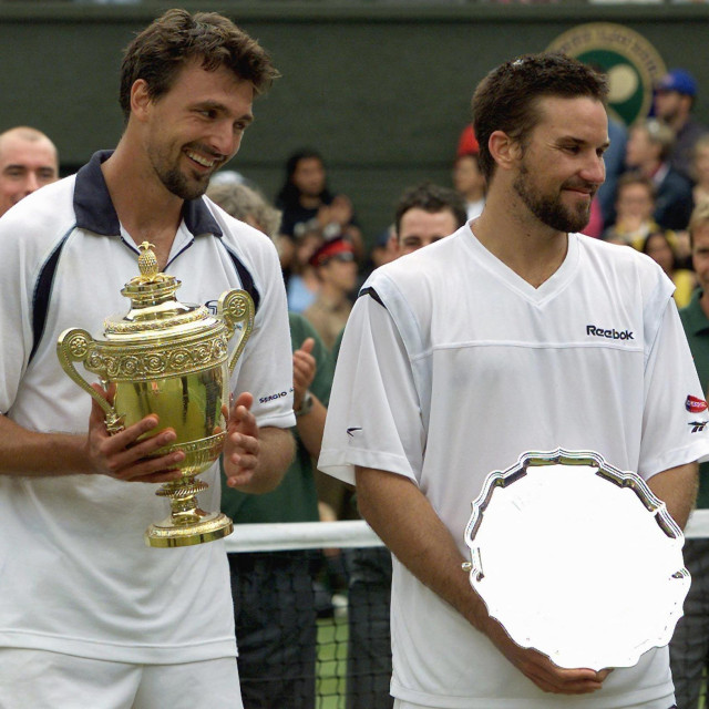 <p>Croatian player Goran Ivanisevic (L) and Australian Patrick Rafter (R) pose with their trophies after Men&lsquo;s Single Final at the All England Tennis Championships in Wimbledon, Monday 09 July 2001. Ivanisevic won 6-3, 3-6, 6-3, 2-6, 9-7. AFP PHOTO GERRY PENNY,Image: 20452224, License: Rights-managed, Restrictions:, Model Release: no, Credit line: GERRY PENNY/AFP/Profimedia</p>