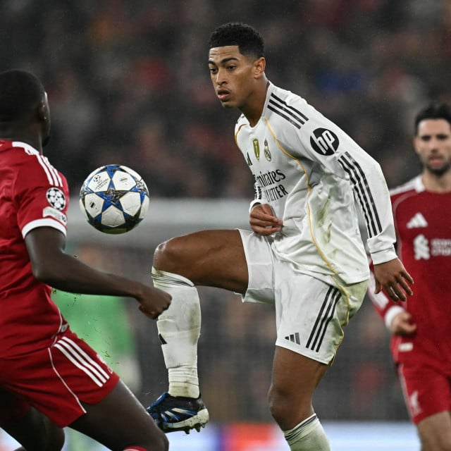 <p>Real Madrid&lsquo;s English midfielder #05 Jude Bellingham (C) vies with Liverpool&lsquo;s French defender #05 Ibrahima Konate (L) during the UEFA Champions League, league phase football match between Liverpool and Real Madrid at Anfield in Liverpool, north west England on November 4, 2025. (Photo by Paul ELLIS/AFP)</p>