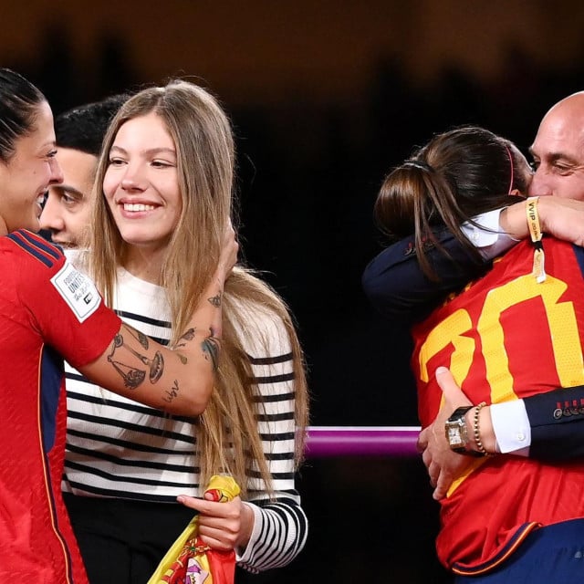 <p>(FILES) Spain&lsquo;s defender #20 Rocio Galvez is congratuled by President of the Royal Spanish Football Federation Luis Rubiales (R) next to Spain&lsquo;s Jennifer Hermoso after winning the Australia and New Zealand 2023 Women&lsquo;s World Cup final football match between Spain and England at Stadium Australia in Sydney on August 20, 2023. A Spanish court on February 20, 2025 convicted former football chief Luis Rubiales of sexual assault over the forced kiss he gave star forward Jenni Hermoso and fined him 10,800 euros ($11,300). But the court acquitted him and the three other accused in the case of the charge of coercion over the affair. (Photo by FRANCK FIFE/AFP)</p>