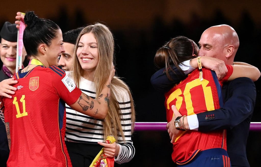 <p>(FILES) Spain&lsquo;s defender #20 Rocio Galvez is congratuled by President of the Royal Spanish Football Federation Luis Rubiales (R) next to Spain&lsquo;s Jennifer Hermoso after winning the Australia and New Zealand 2023 Women&lsquo;s World Cup final football match between Spain and England at Stadium Australia in Sydney on August 20, 2023. A Spanish court on February 20, 2025 convicted former football chief Luis Rubiales of sexual assault over the forced kiss he gave star forward Jenni Hermoso and fined him 10,800 euros ($11,300). But the court acquitted him and the three other accused in the case of the charge of coercion over the affair. (Photo by FRANCK FIFE/AFP)</p>