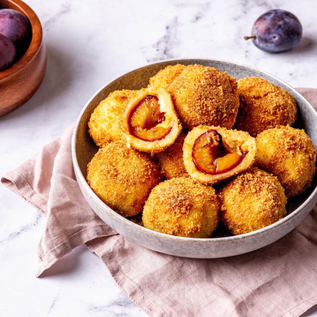 <p>Homemade plum dumplings, famous in Germany as Zwetschgenknoedel snf on Balkans as knedle sa &scaron;ljivama are traditional dessert with autumn fruit, horizontal food image recipe</p>