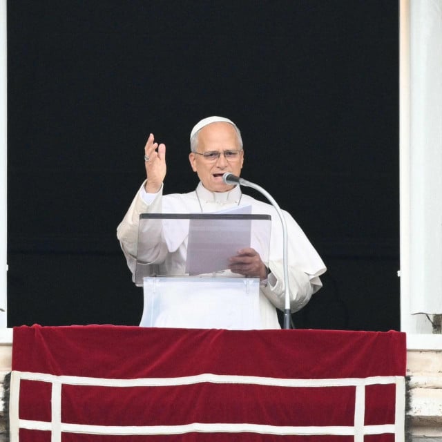 <p>Pope Leo XIV addresses the crowd from the window of the apostolic palace overlooking St. Peter&lsquo;s square during the Angelus prayer a day after his return to The Vatican following a surgery to remove a cancerous tumour in his right lung, on October 18, 2026. (Photo by Tiziana FABI/AFP)</p>