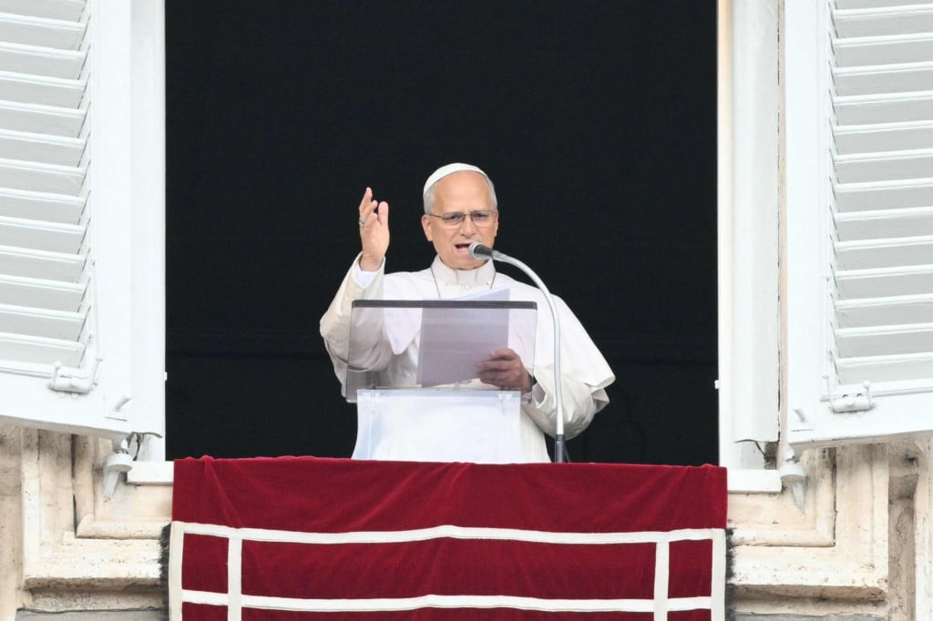 <p>Pope Leo XIV addresses the crowd from the window of the apostolic palace overlooking St. Peter&lsquo;s square during the Angelus prayer a day after his return to The Vatican following a surgery to remove a cancerous tumour in his right lung, on October 18, 2026. (Photo by Tiziana FABI/AFP)</p>